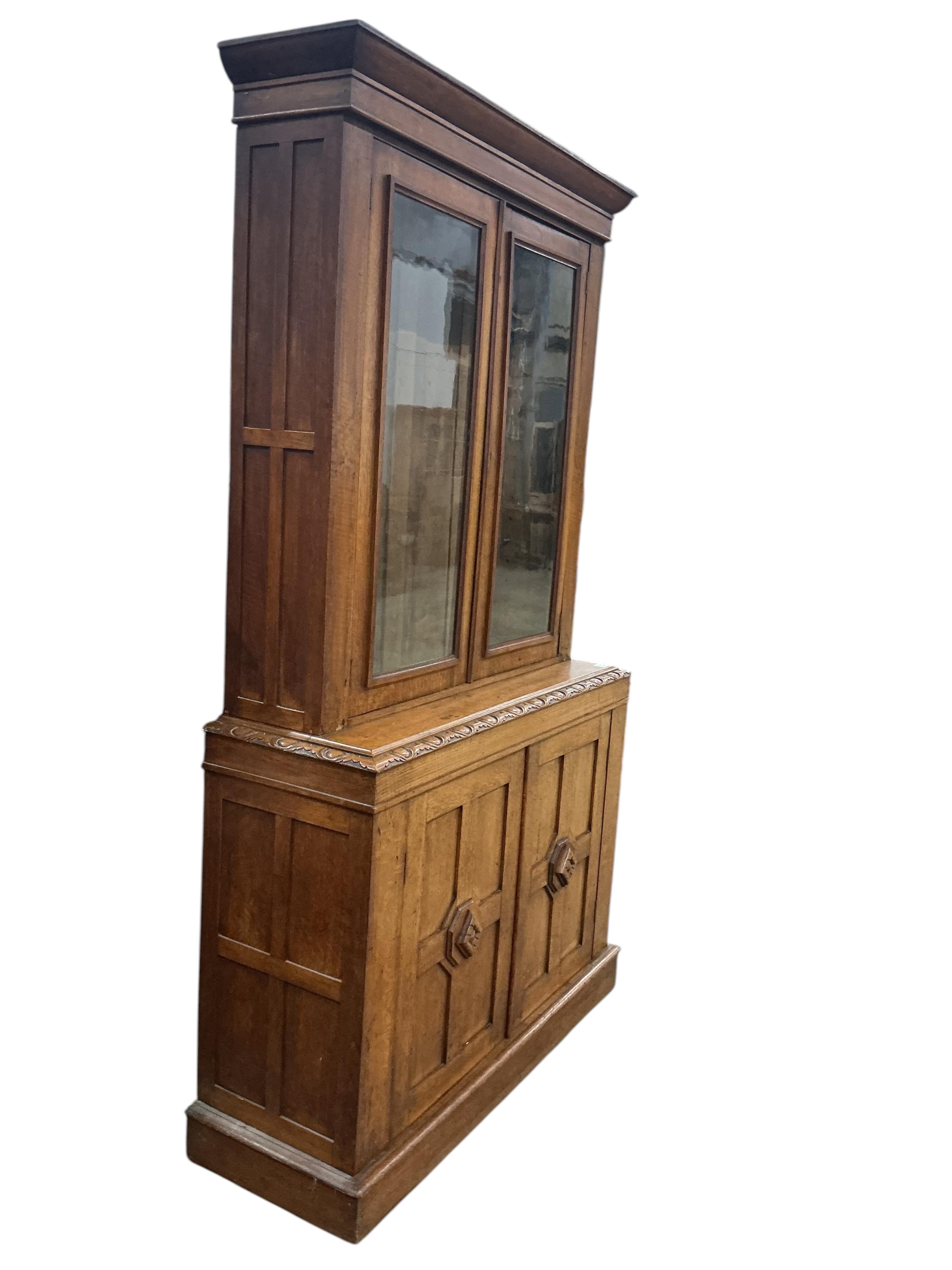 A late Victorian oak library bookcase, width 118cm, depth 40cm, height 210cm